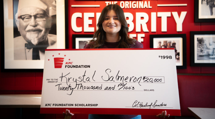 woman holding an oversized check