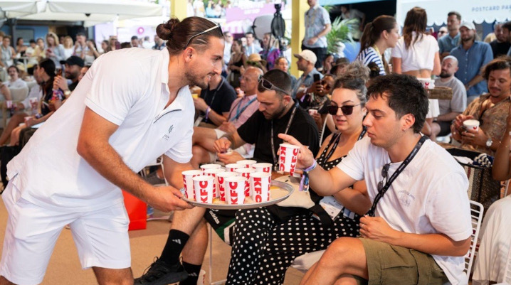 Waiter serving KFC to people