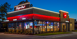Exterior of a Pizza Hut restaurant with an inline/endcap