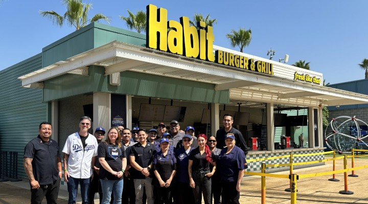 Team standing in front of Habit Burger & Grill x Home Base location