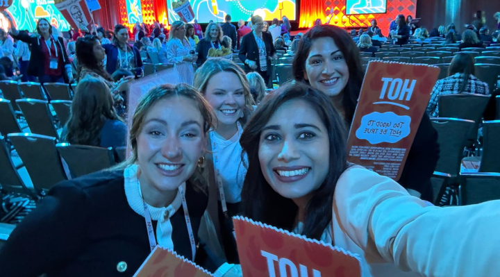 women at a conference taking a selfie