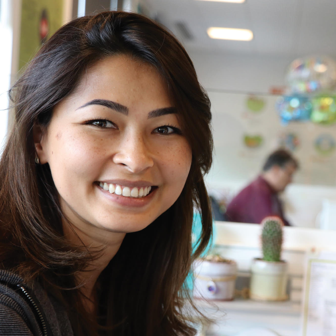 Portrait of a female Asian Yum! Employee at her workstation Portrait of a female Asian Yum! Employee at her workstation