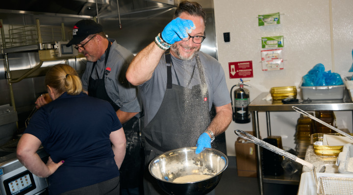 Chef Jason Triail cooks in the kitchen.