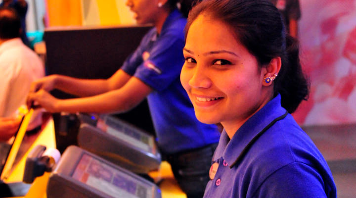 Photo of a Taco Bell India team member attending a restaurant cash register Photo of a Taco Bell India team member attending a restaurant cash register