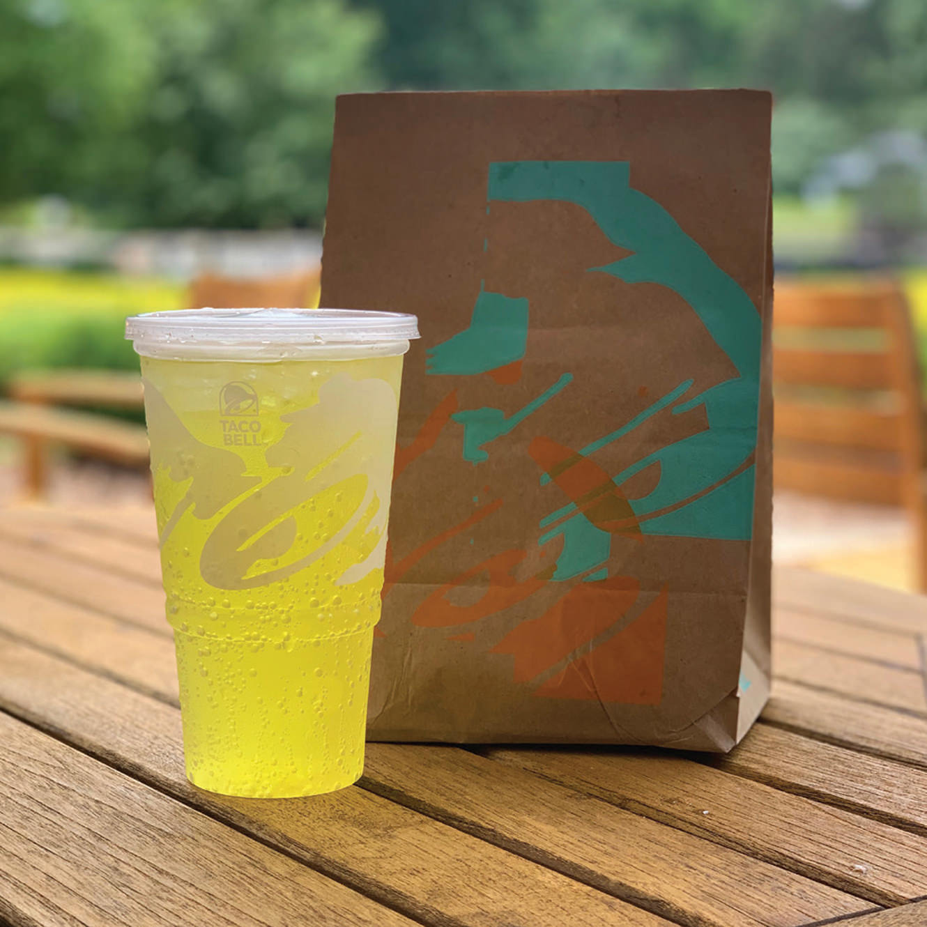 Environmentally-friendly Taco Bell packaging, including a bag and a cup Environmentally-friendly Taco Bell packaging, including a bag and a cup